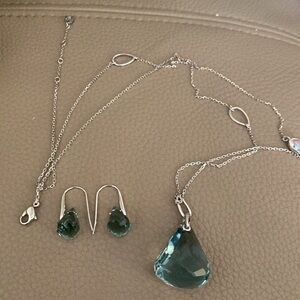 Swarovsky crystal pendant with matching earrings.